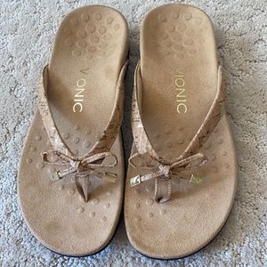 Bionic tan sandals with golf accents, never worn